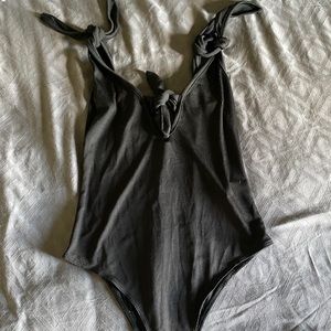 Back adjustable body suit